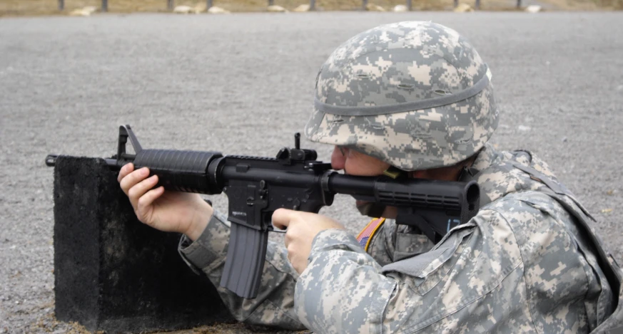 an air force soldier using an automatic rifle