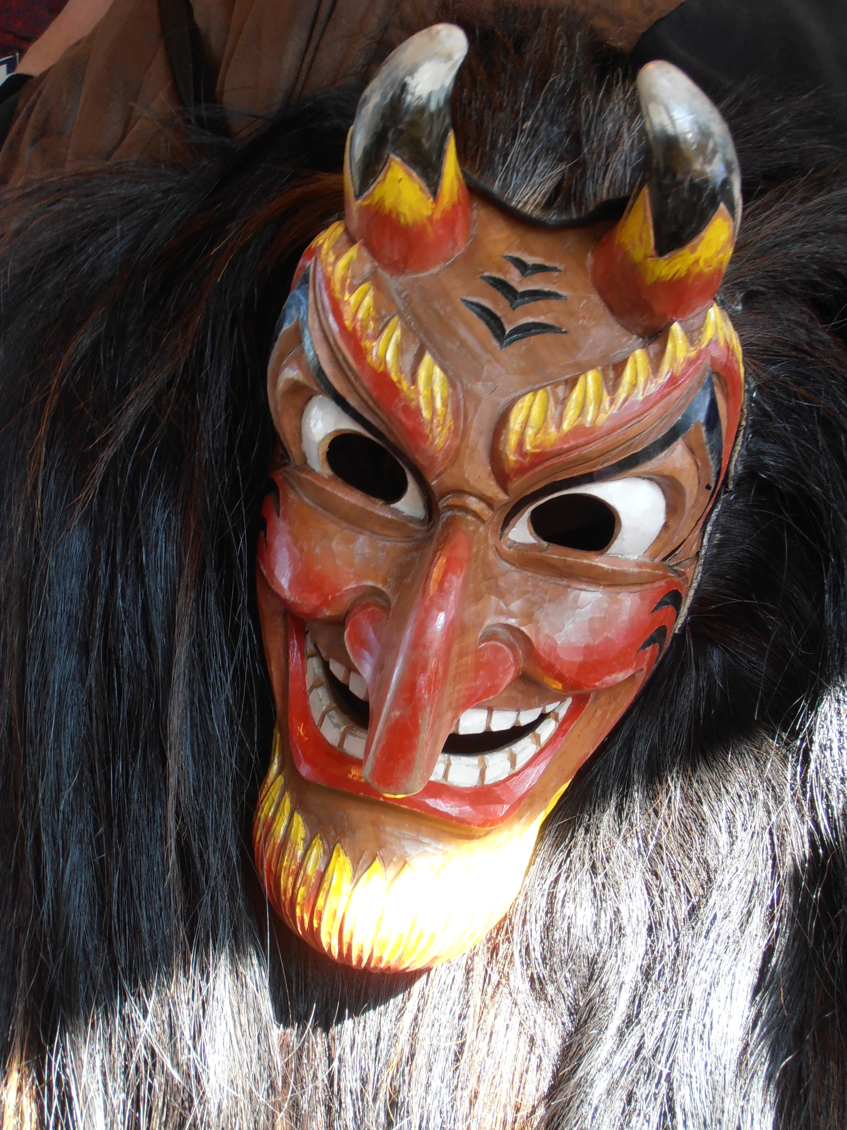 a scary mask is wearing fur in a costume