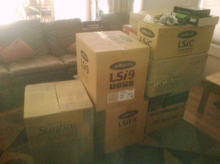 boxes piled up on the floor in a living room