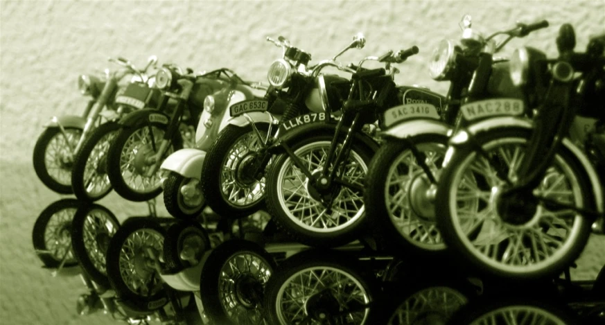 there are motorcycles parked together on a wall