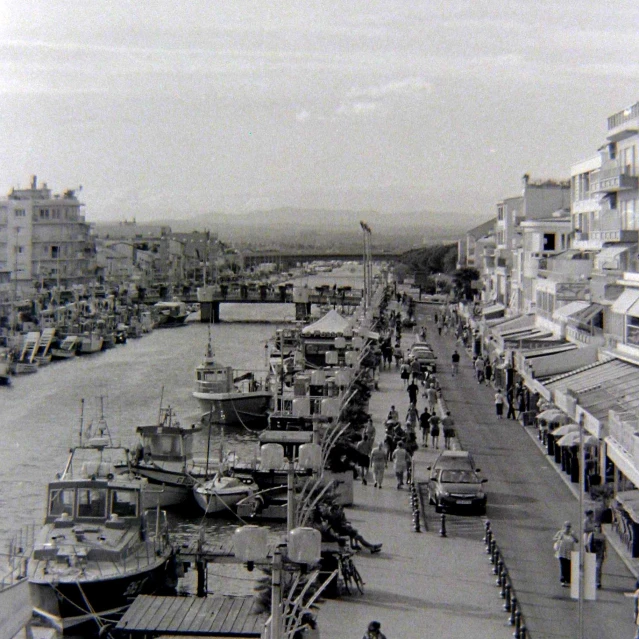 black and white po of several boats docked in the water