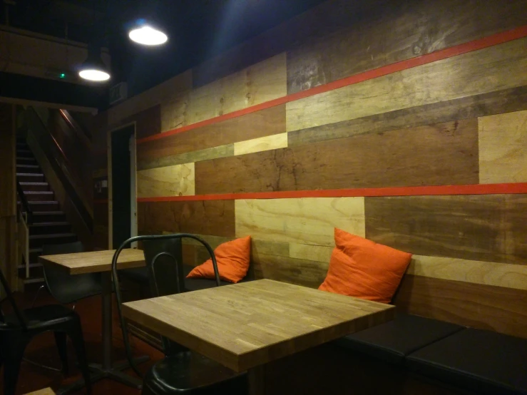 the interior of a restaurant with wooden paneling