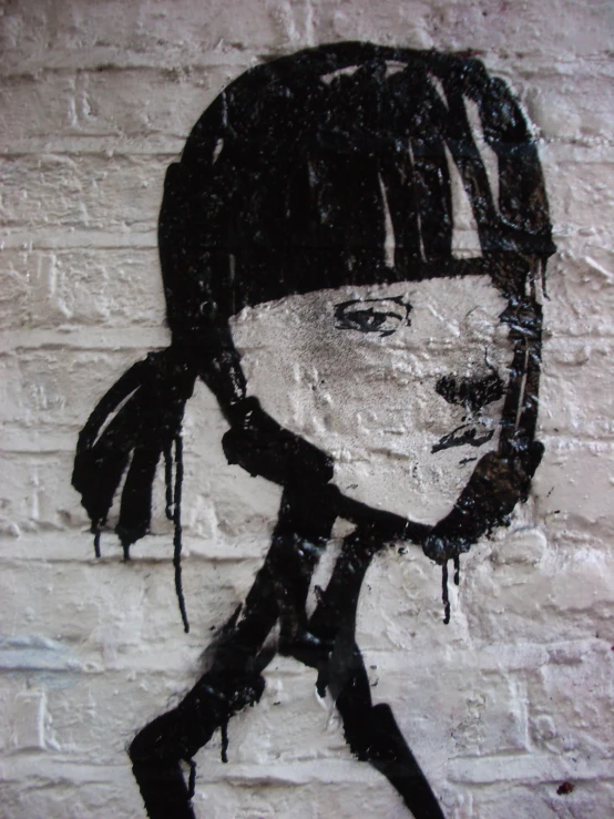 a black and white graffiti of a woman wearing a bandana