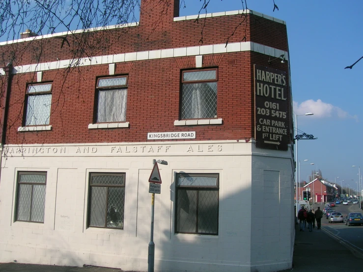 a white and red building on the corner