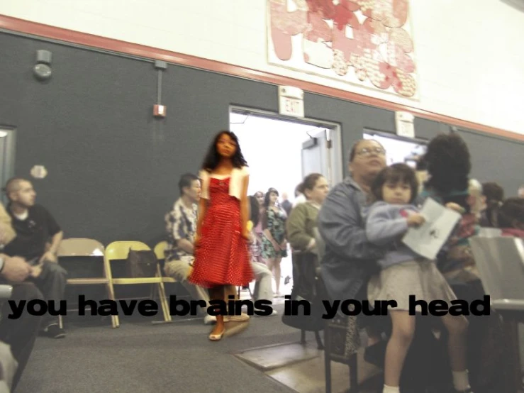 a girl walking in a school hallway during a class