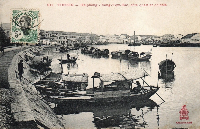 the harbor of a city is crowded with small boats