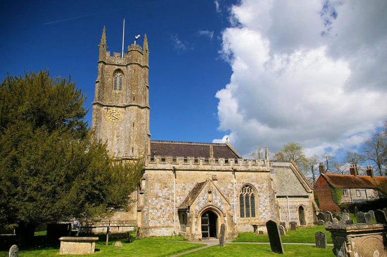 an old castle type building with a large steeple