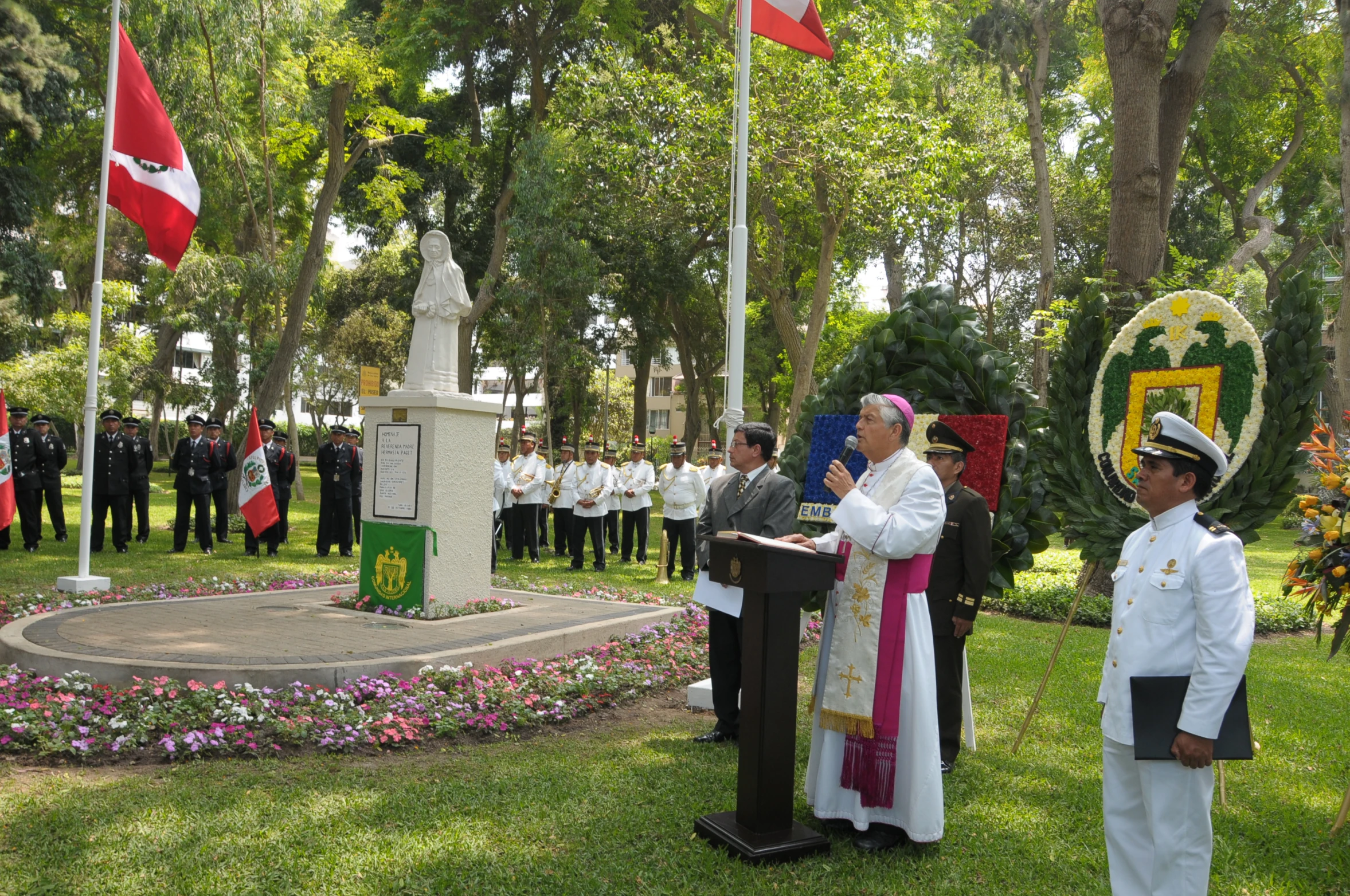 the people in uniform are looking at the flags