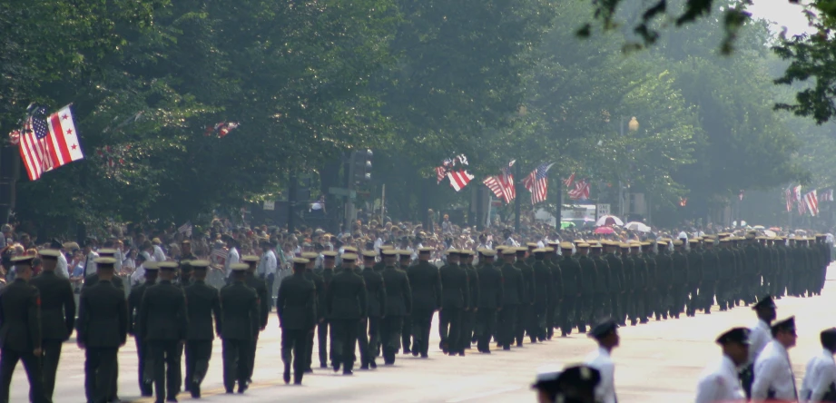 there is a military parade with men and women in uniforms