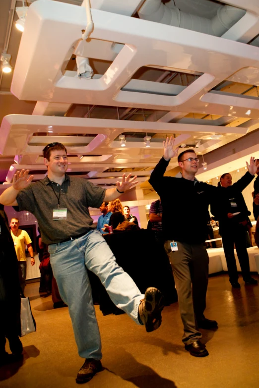 a man is doing some type of dance with a band member