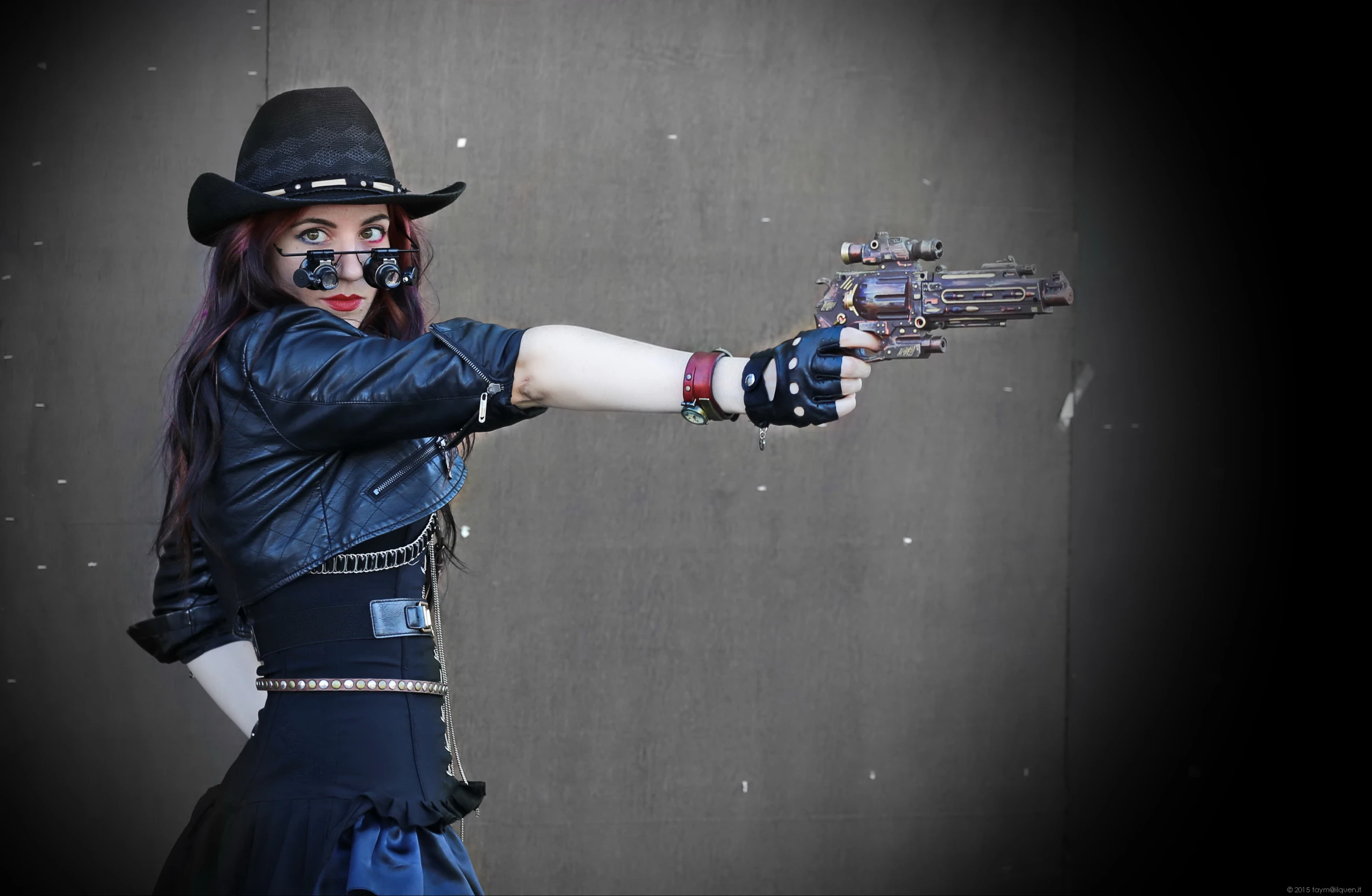 a person wearing a western style costume holding guns