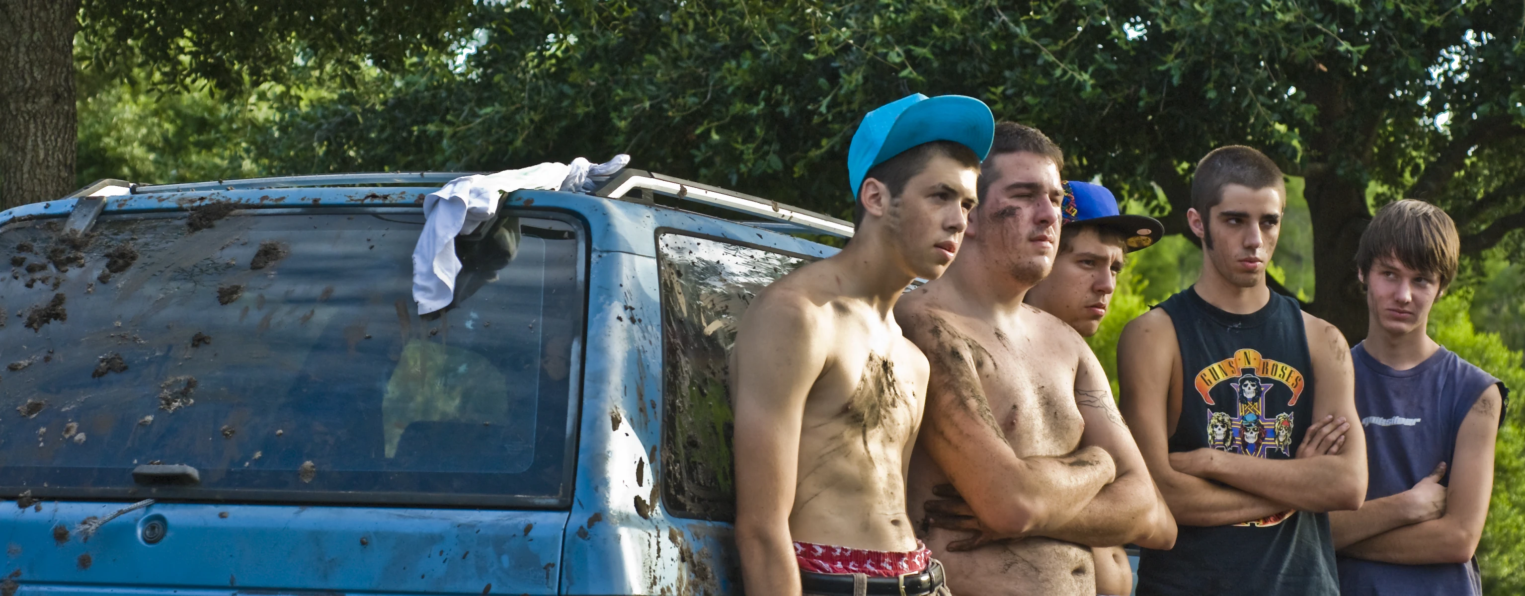 several men are standing near a van with it's doors opened