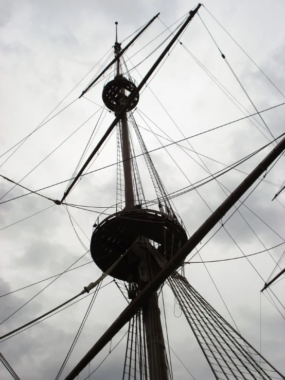 a pirate ship mast looking up to the sky