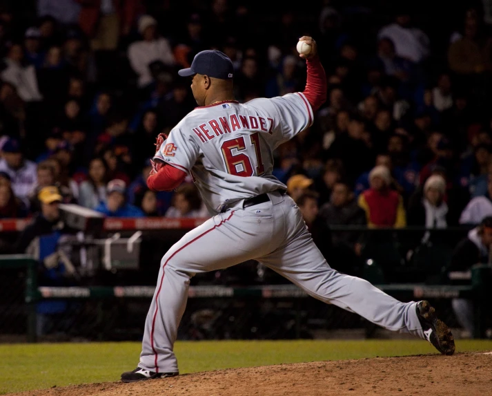 baseball player about to throw ball during game in stadium