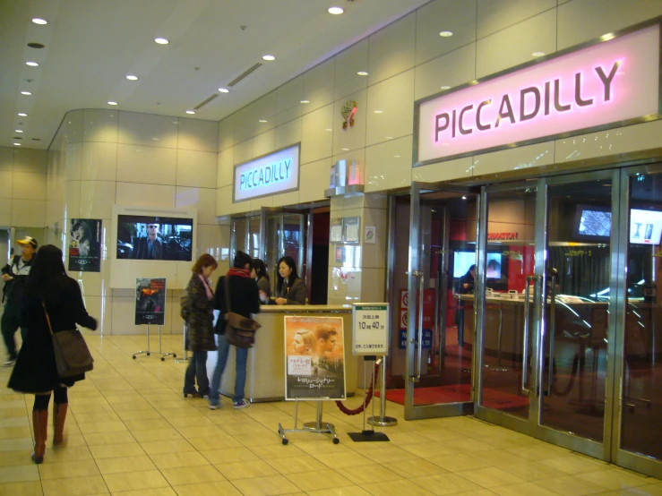 people walking down the steps of a shopping center