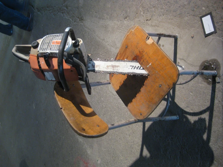 a worn and broken chair has been placed on a bench