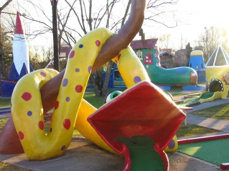 a children's playground with several different sized play areas