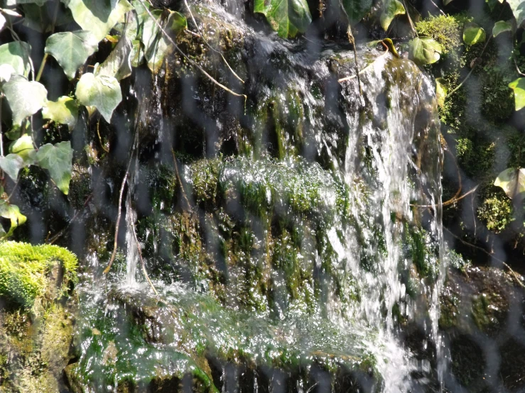 this image depicts a very waterfall with water spraying down it