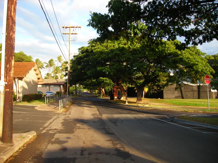 a city street is empty and quiet from the sun