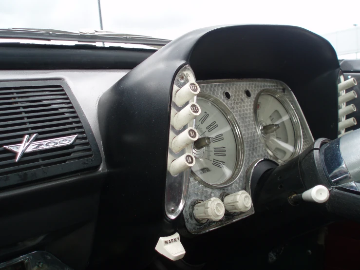 a close up of the dash control wheel and dash gauge of a car