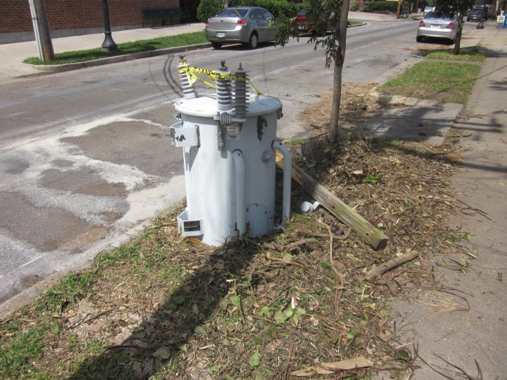 an electric transformer on the side of the road