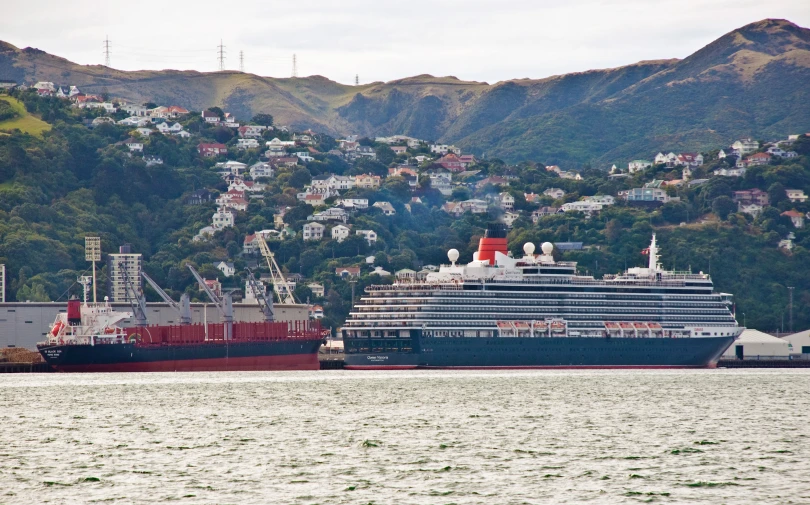 a cruise ship and a barge in the water