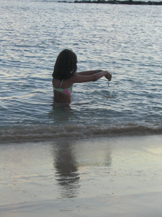 a woman that is sitting in some water