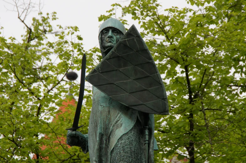 a statue with a large piece of material in his hand