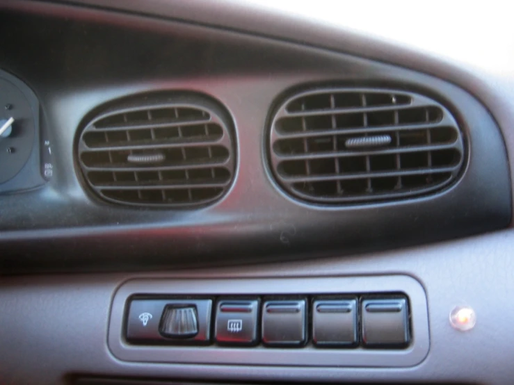 a close up view of a radio in a vehicle