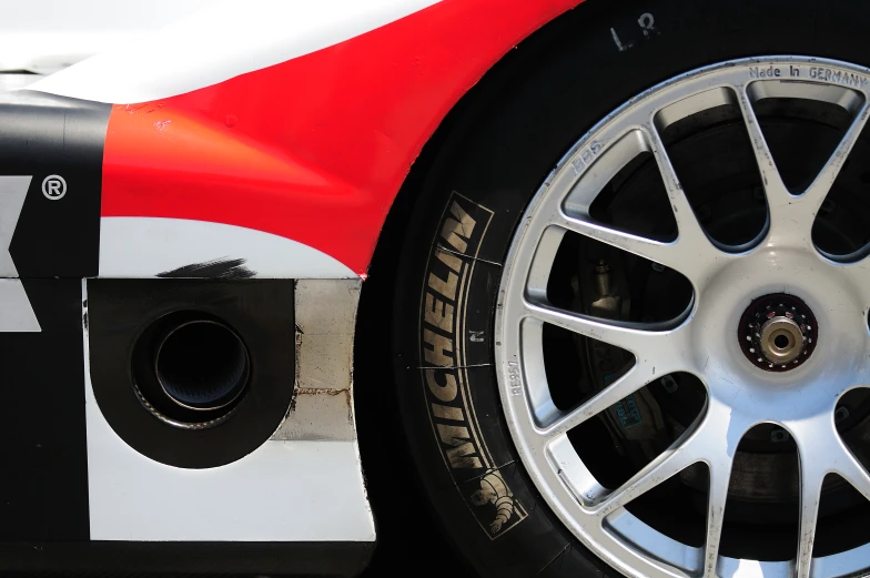 the rear wheel and tire are covered with a white stripe