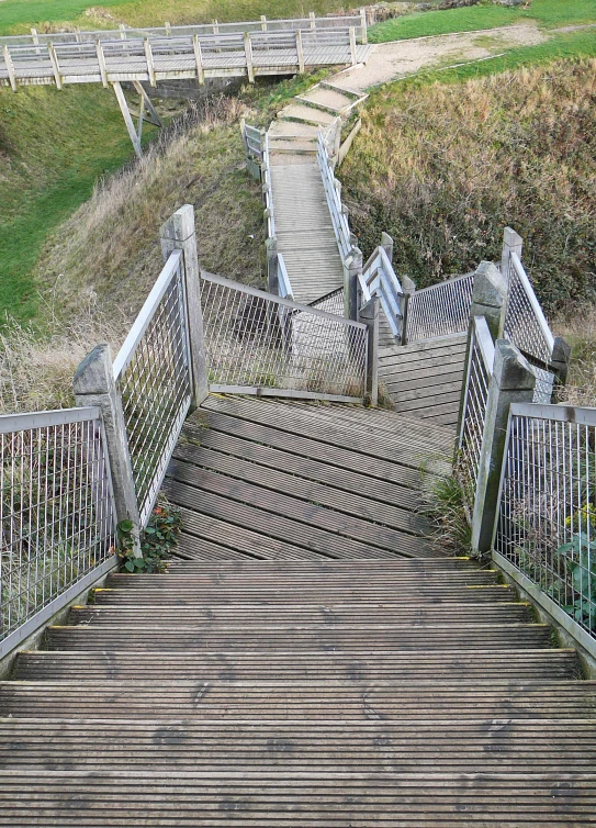 steps leading down to the beach to go surfing