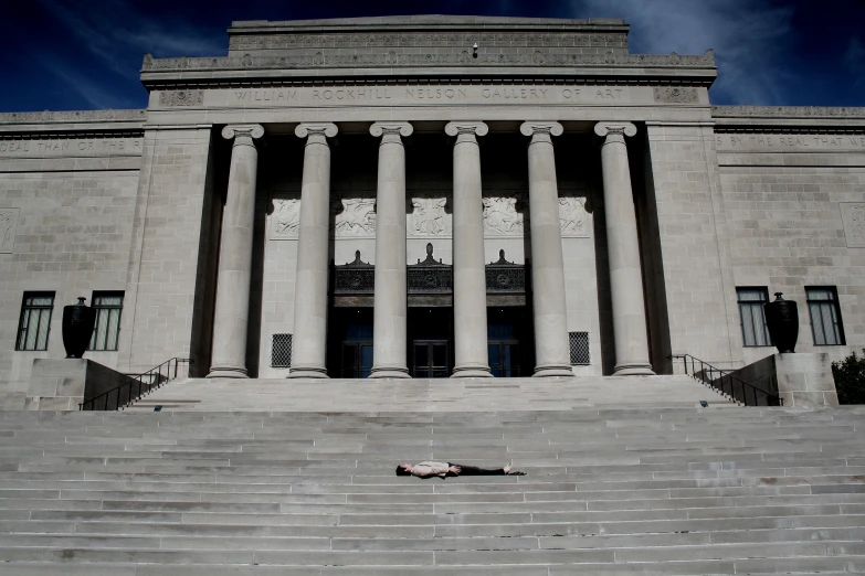 an entrance to a building with pillars and steps