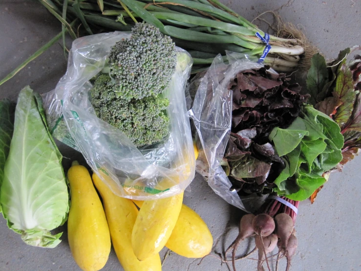 a bunch of assorted veggies and beans are laying on a table