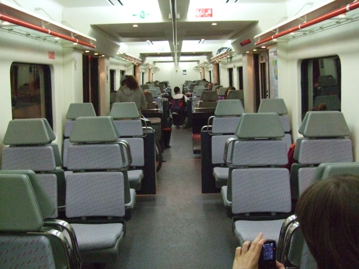 the front room of a subway car that has no passengers