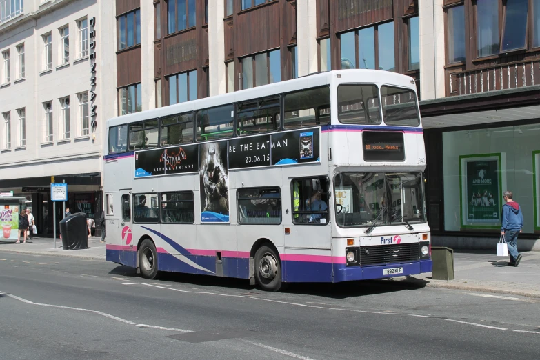 a double decker bus parked on the side of the road