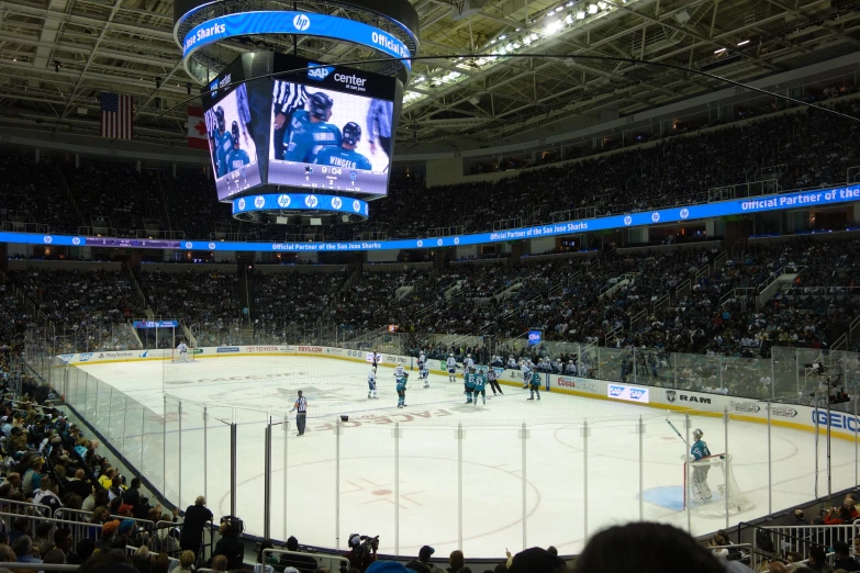 a hockey game is being played on an ice rink