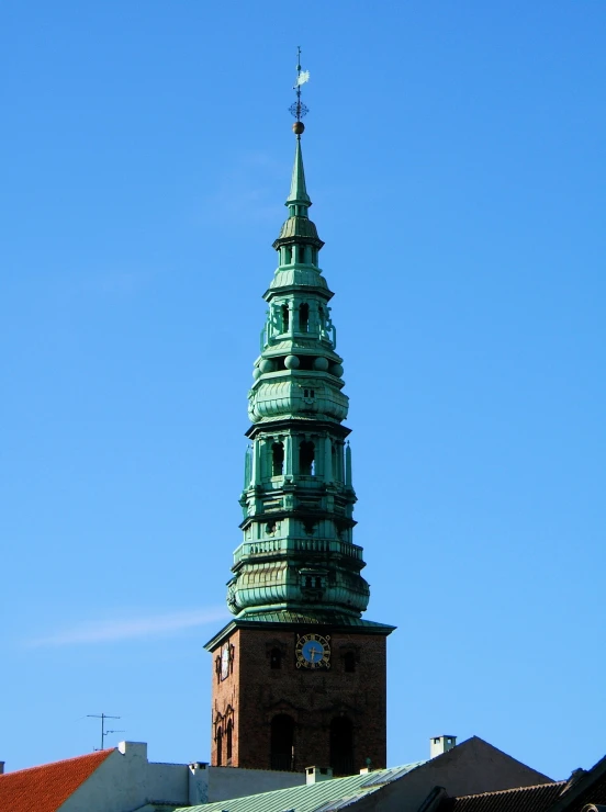 a tower with a clock on the front and side of it