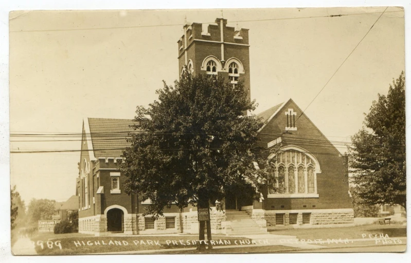 an old time church with steeple and trees
