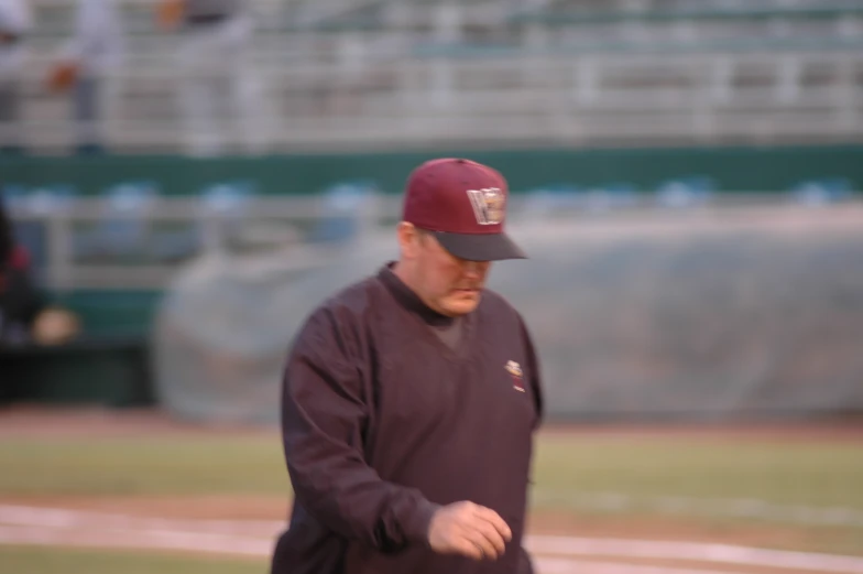 a baseball player is walking on the field