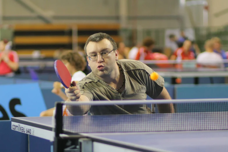 a man is preparing to hit a tennis ball