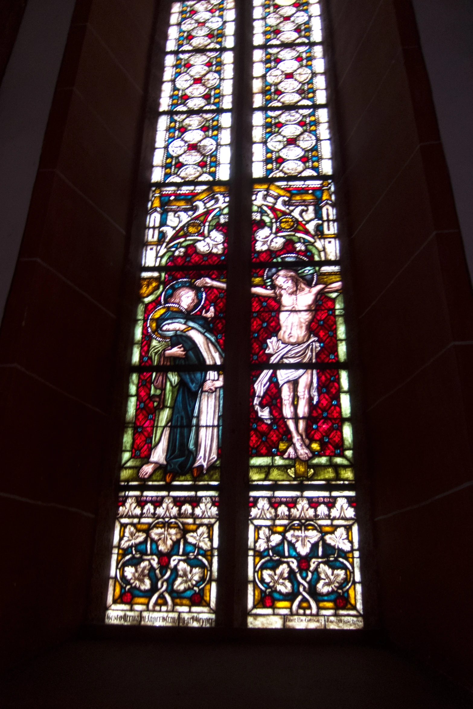 a stain glass window on the side of a building