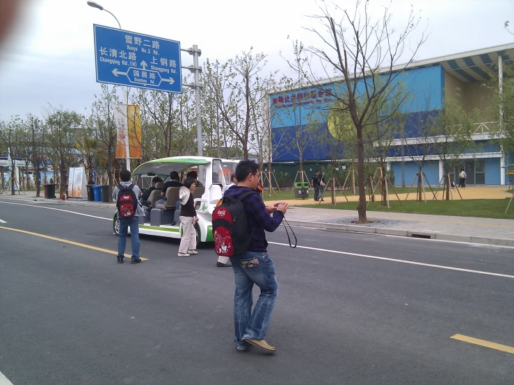 people wait for the bus to arrive