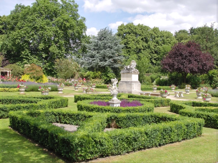 formal garden area with clipped hedges and sculpture