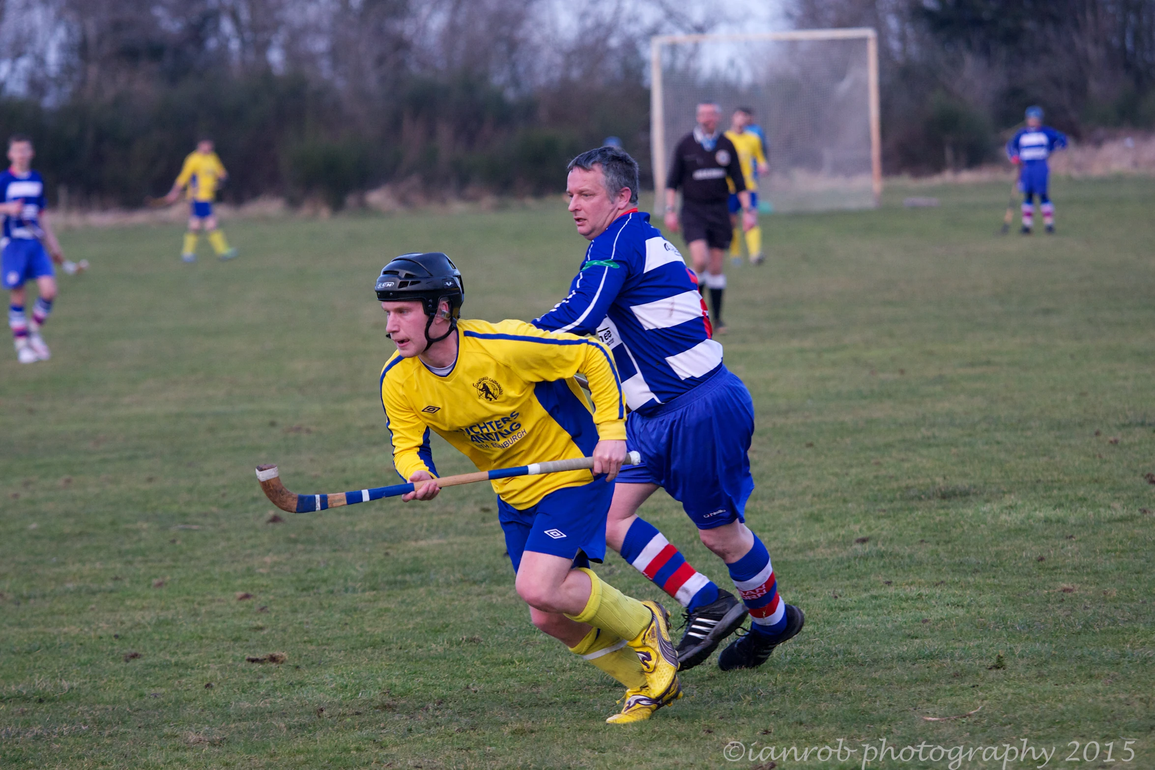 a group of men play a game of soccer