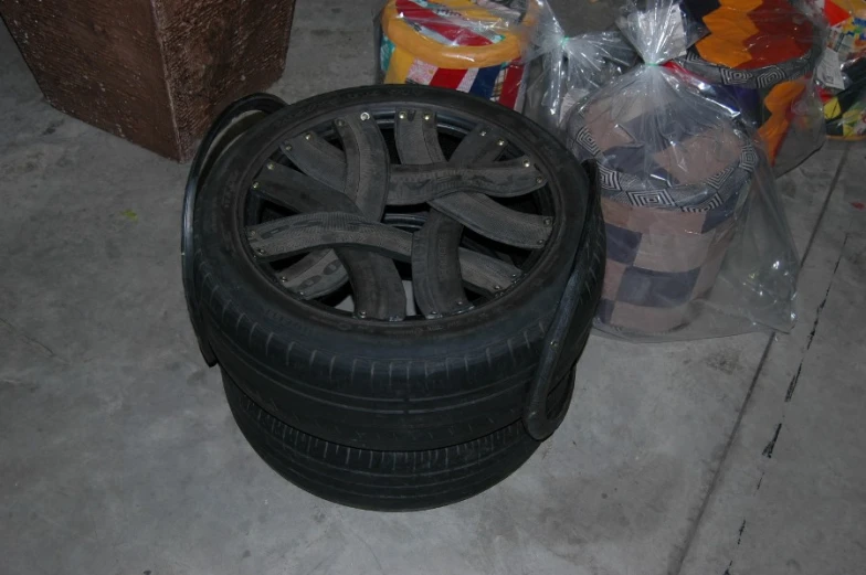 some old tires are laying beside other stuff