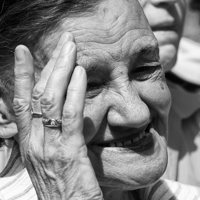 a close up of a person holding a ring