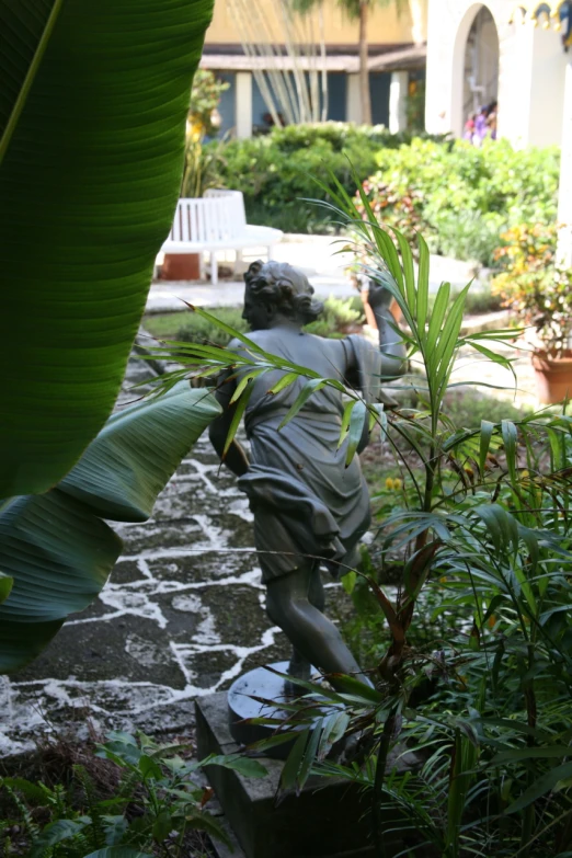 a statue is in the front yard near a lawn