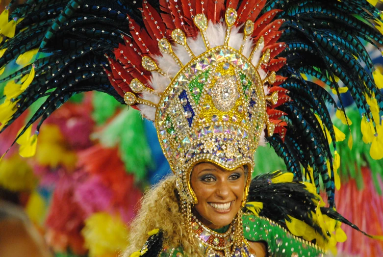 the dancer is smiling and brightly dressed