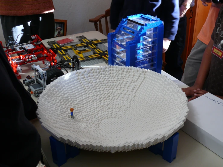 a table with a model city set made out of legos