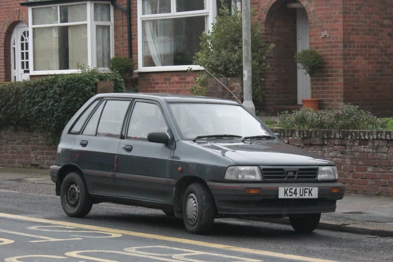 an image of a grey car parked on the street